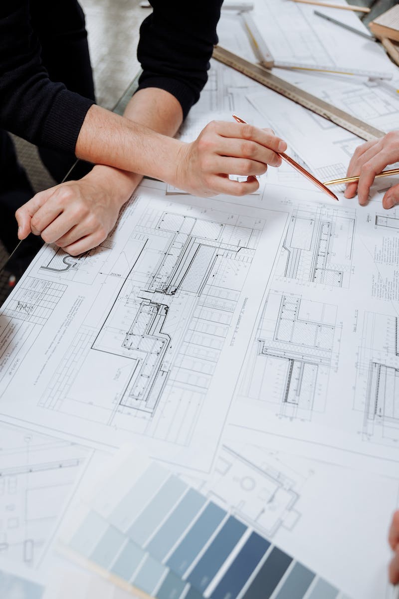 Close-Up Photo of an Architect Planning a Schematic Diagram
