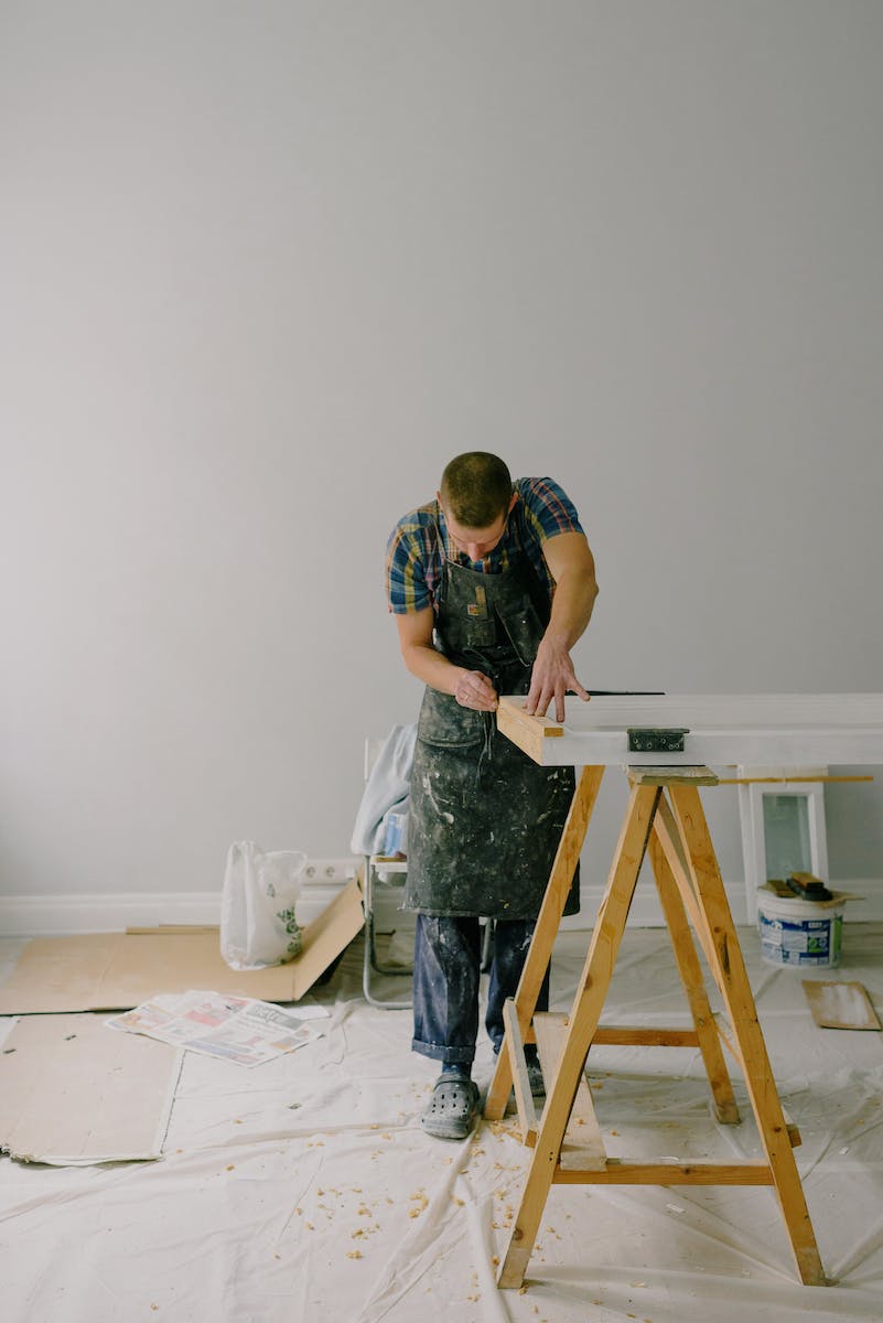 Concentrated man making repairs at home