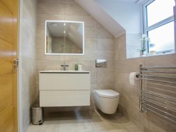 Sink and Toilet Seat in Bathroom