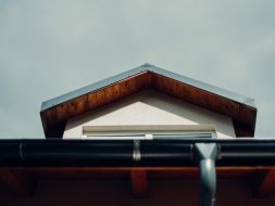 brown wooden roof under white sky during daytime